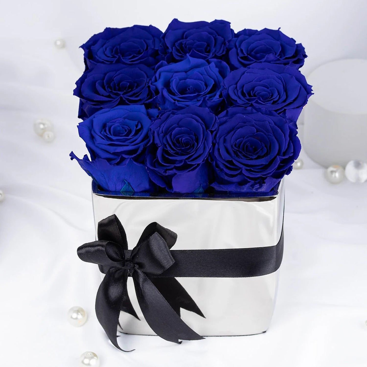 Elegant Blue Forever Roses in Luxurious Silver Vase