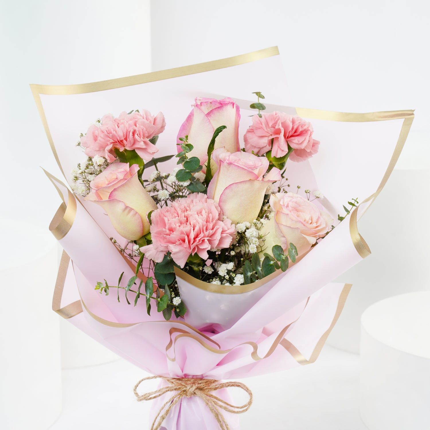 Elegant Floral Tribute: Pink Roses and Carnations Bouquet