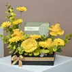 Elegant Yellow Floral Arrangement with Gourmet Chocolates