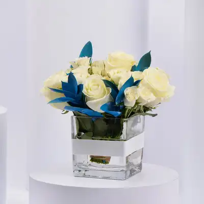 Elegant White Roses and Blue Ruscus Glass Vase Arrangement