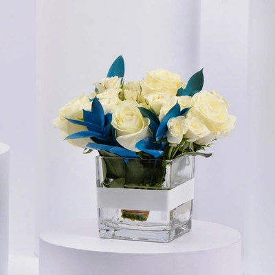 Elegant White Roses and Blue Ruscus Glass Vase Arrangement