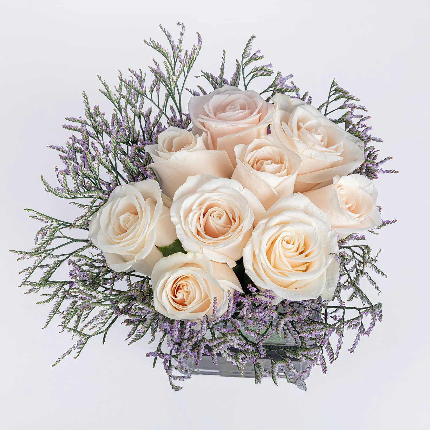 Elegant Arrangement: 9 White Roses in a Glass Vase
