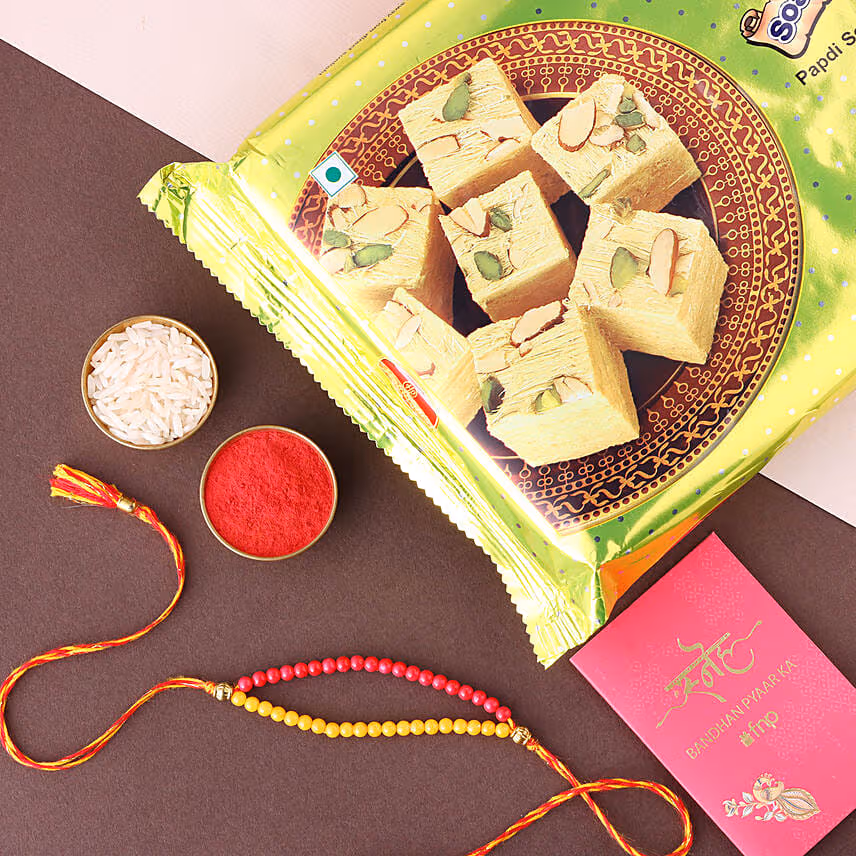 Sneh Red and Yellow Bead Rakhi with Soan Papdi