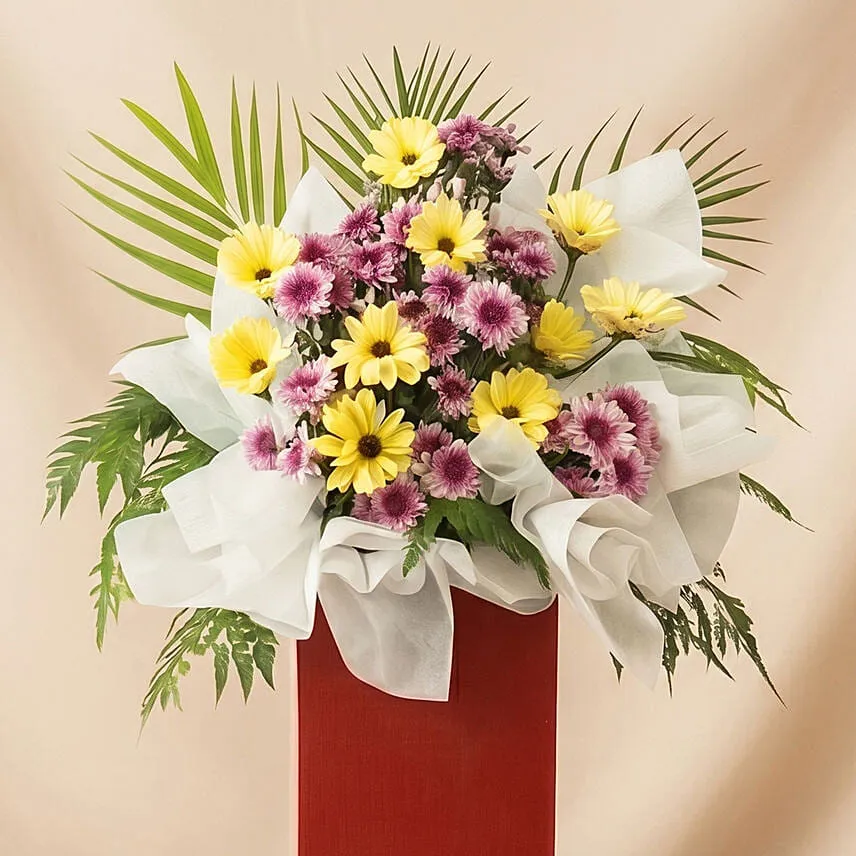 Gerberas Purple Pom In Beautiful Red Stand