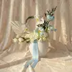 Cloudlight Charm: Elegant Blue Tulip & Orchid Arrangement