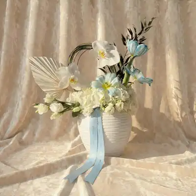 Cloudlight Charm: Elegant Blue Tulip & Orchid Arrangement
