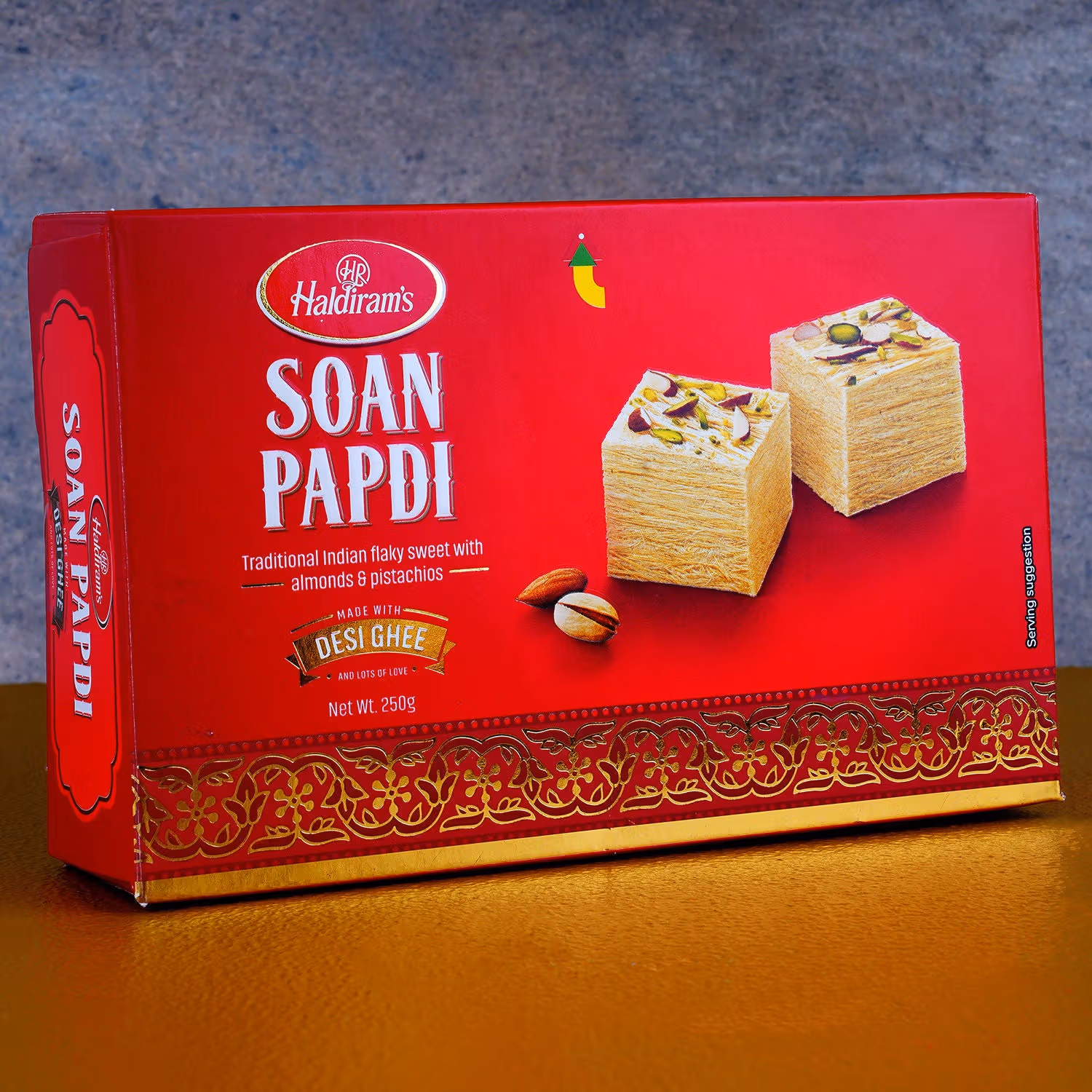 Charming Bal Ganesha Pearl Rakhi for Kids with 250g Haldiram's Soan Papdi Gift Set