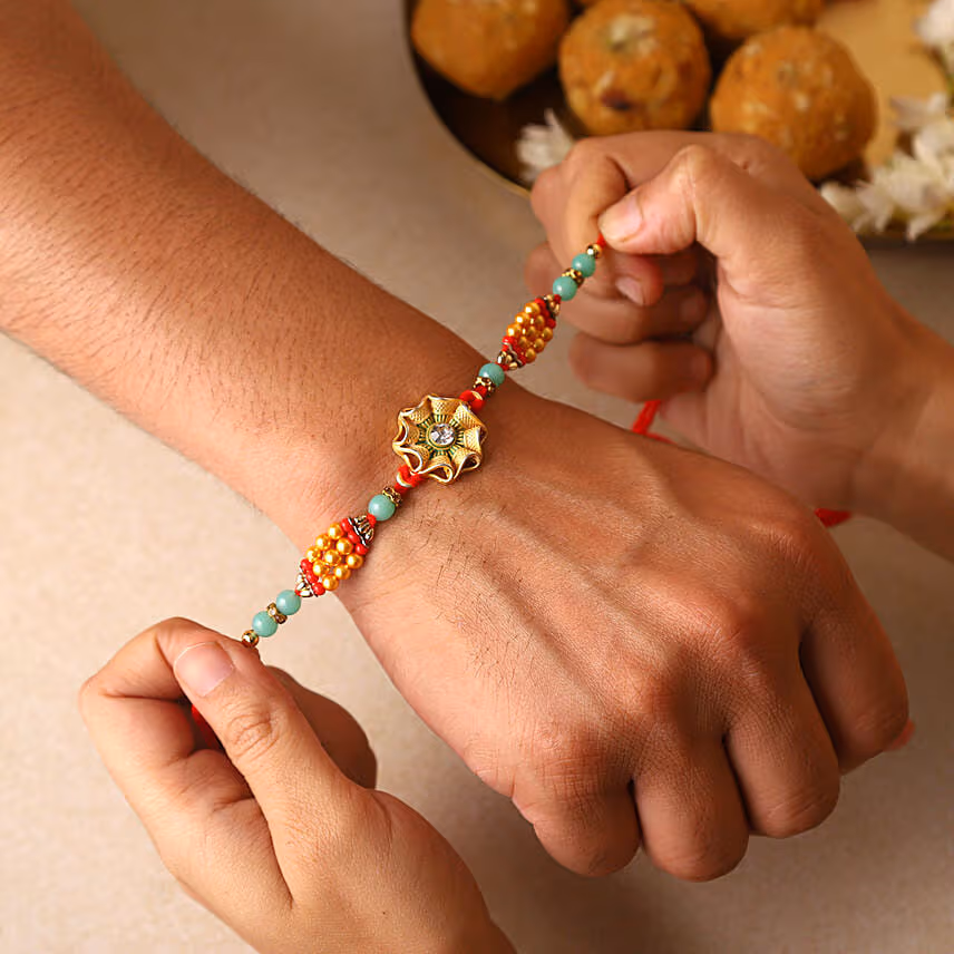 Sneh Trendy Flower Rakhi with Toblerone