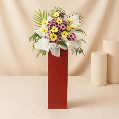 Gerberas Purple Pom In Beautiful Red Stand