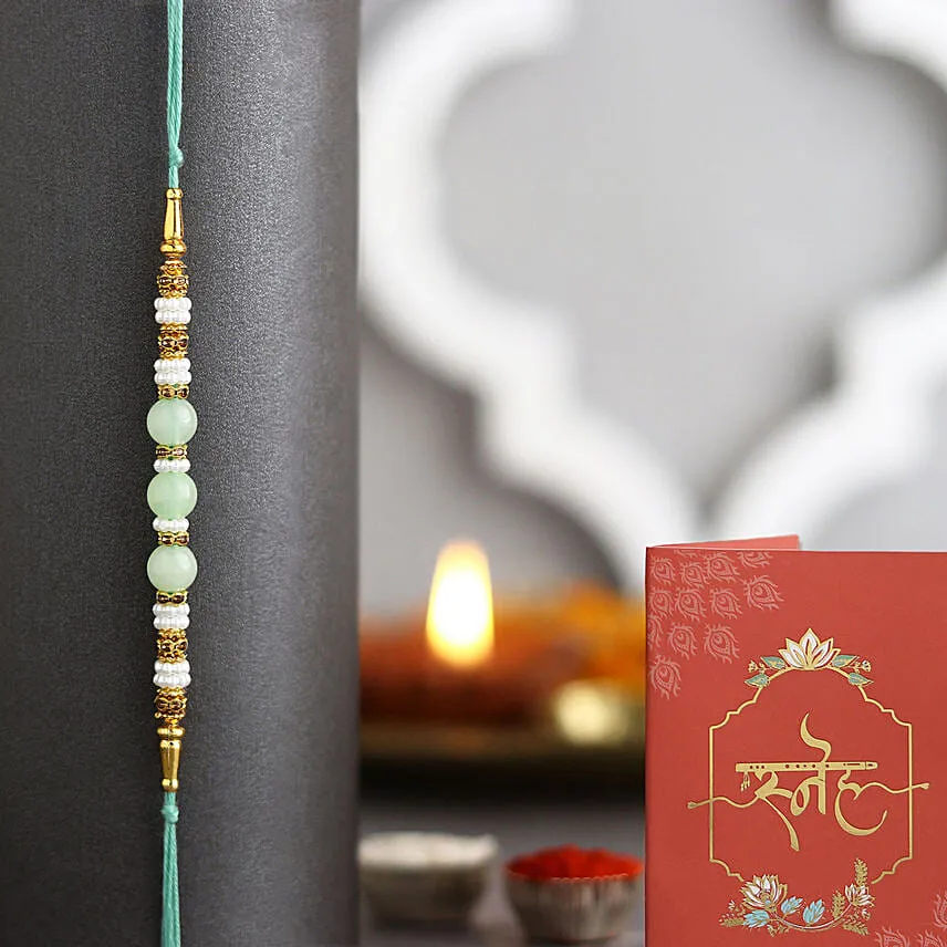 Pink Carnation Elegance Bouquet with Green Pearl Rakhi