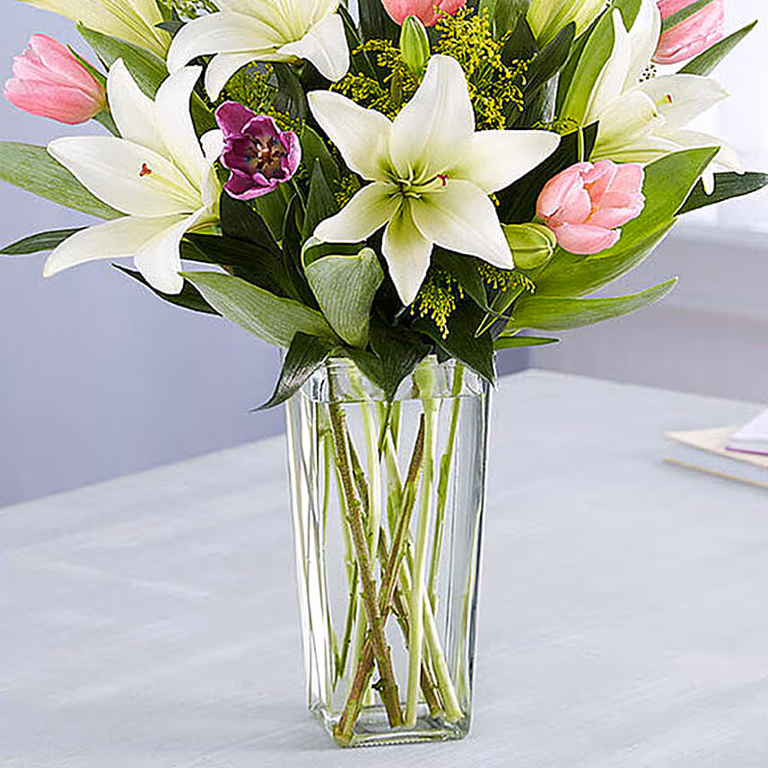 Medley Of Lilies And Tulips With Birthday Balloons