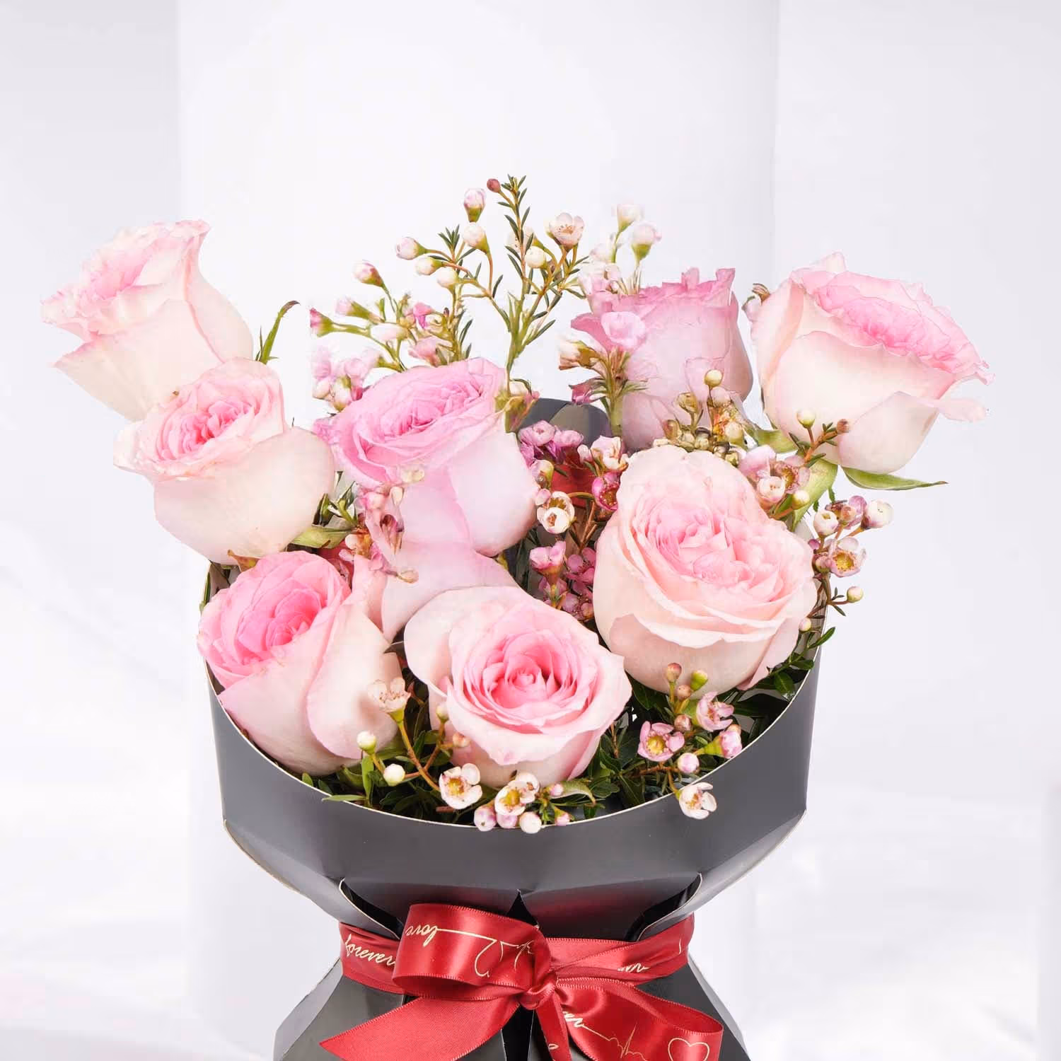 Lovers Bloom: Elegant 8 Pink Roses Bouquet with Wax Flower