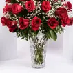 Luxurious Bouquet of 50 Scarlet Red Roses with Elegant Fillers in a Glass Vase