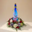 Festive Christmas Floral Arrangement with Illuminated Bottle