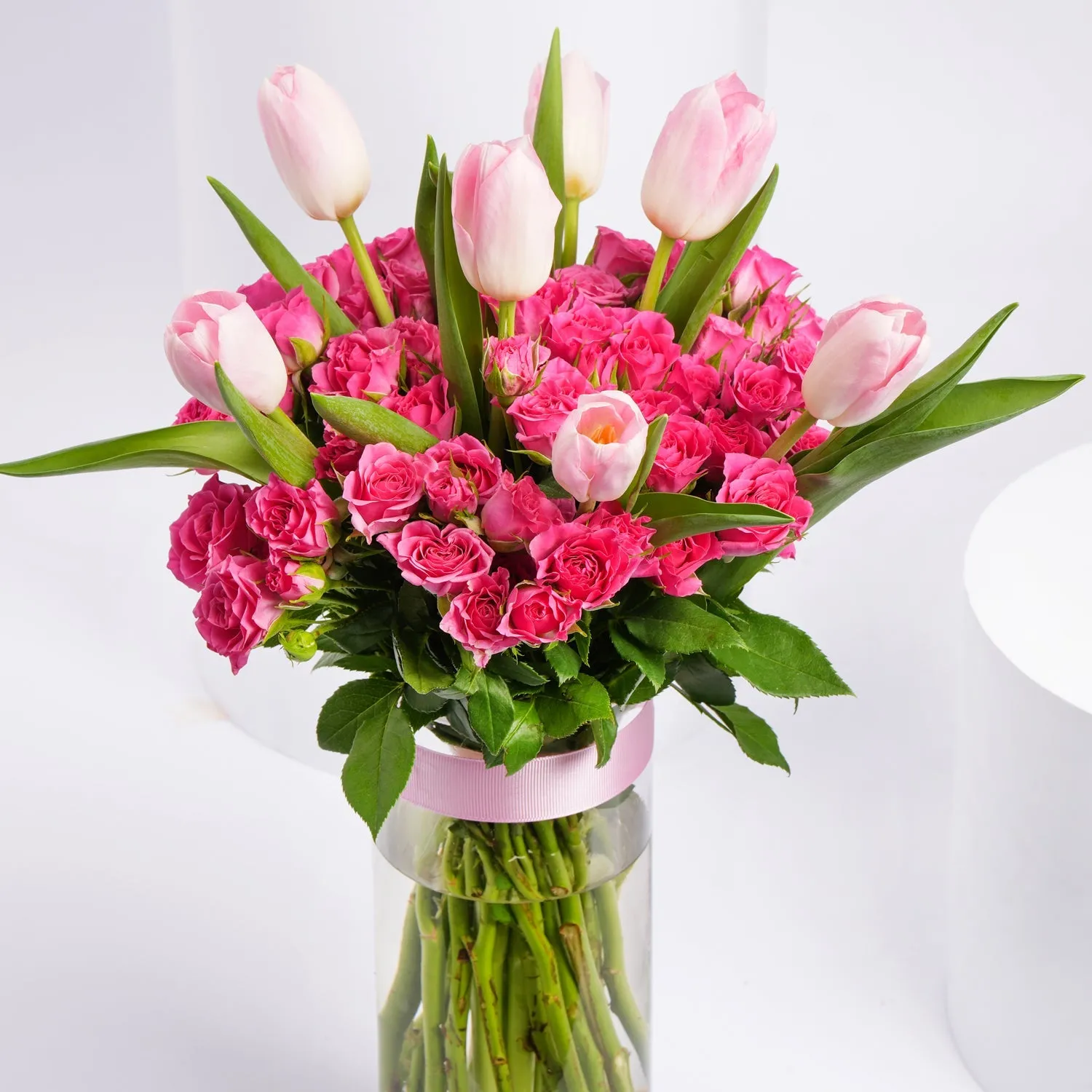 Charming Bouquet of Pink Tulips & Baby Roses in Elegant Glass Vase