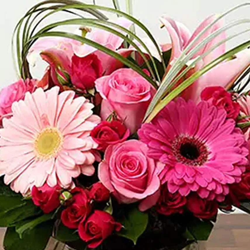 Pink Flowers In Glass Vase With Chocolate Cake