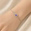 Elegant Purple Glow Silver Bracelet with Infinity Design