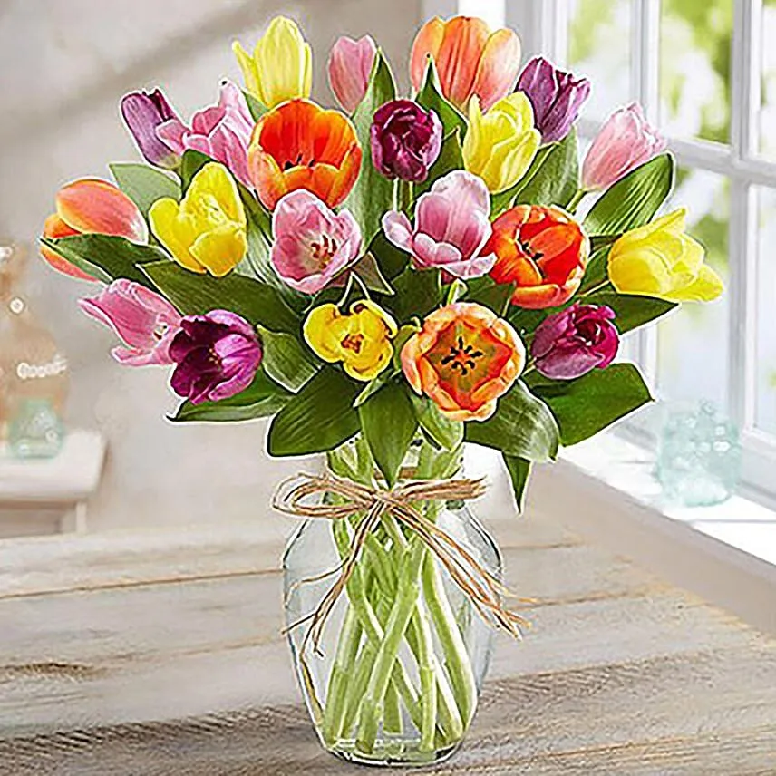 Tulips In Glass Vase With Chocolates & Cake Combo