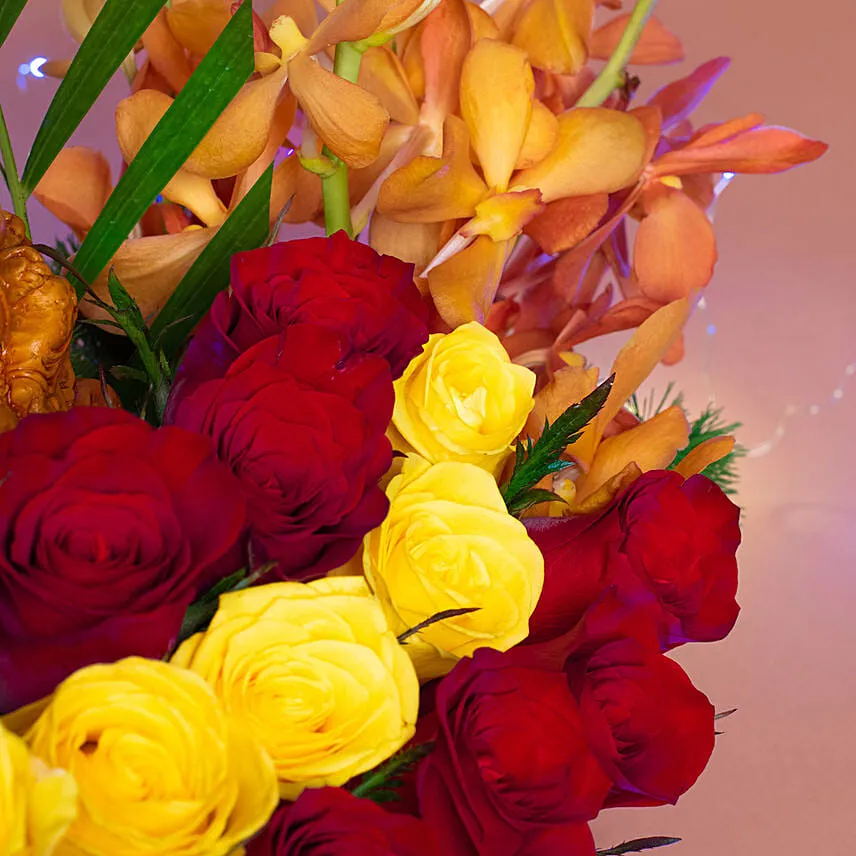 Colourful Flowers N Ganesha Idol Ship Shaped Vase