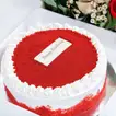 Birthday Bliss: Luxurious Red Velvet Cake with Elegant Floral Arrangement