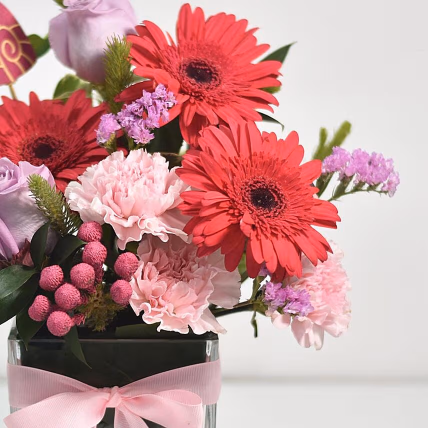 Lovely Mixed Flowers Arrangement In Glass Vase
