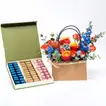 Elegant Floral Arrangement with Luxurious Chocolate Box