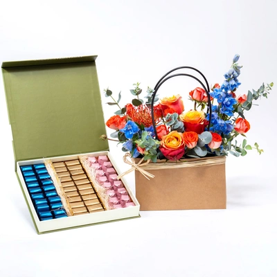Elegant Floral Arrangement with Luxurious Chocolate Box