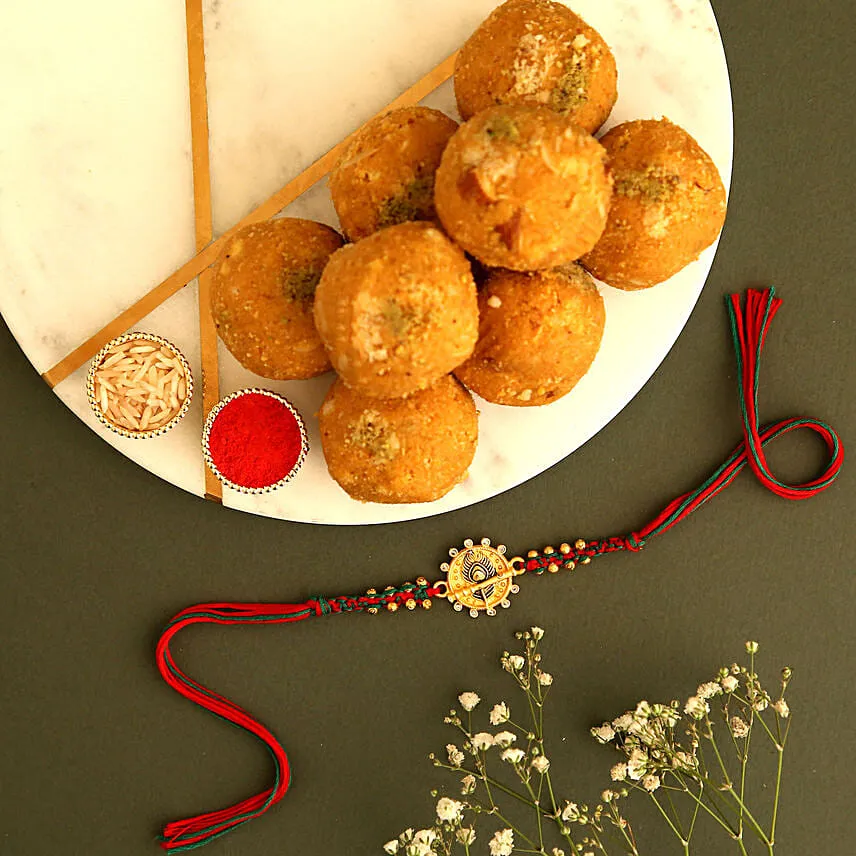 Sneh Gold Floral Rakhi & Besan Ladoos