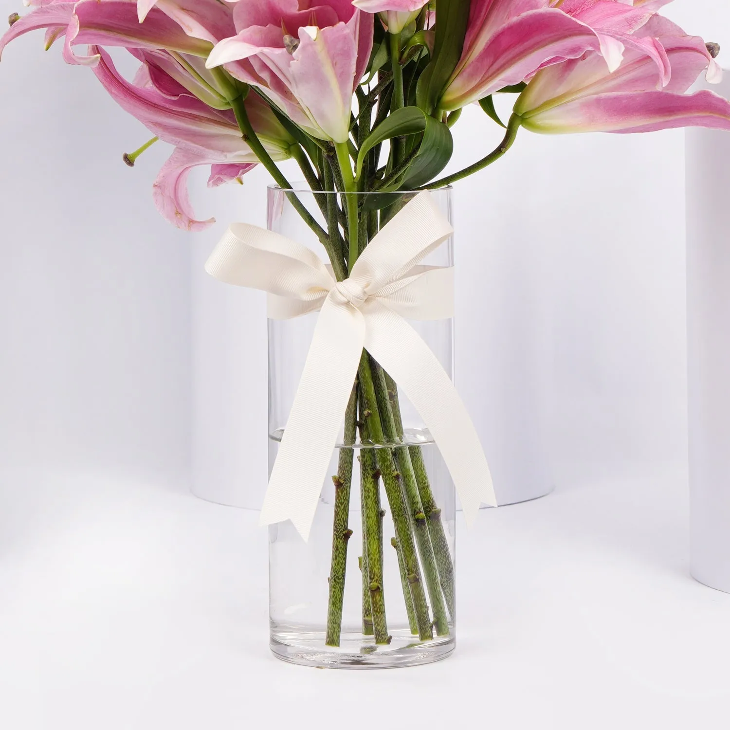 Elegant Blushing Pink Lilies Arrangement with Decorative Topper