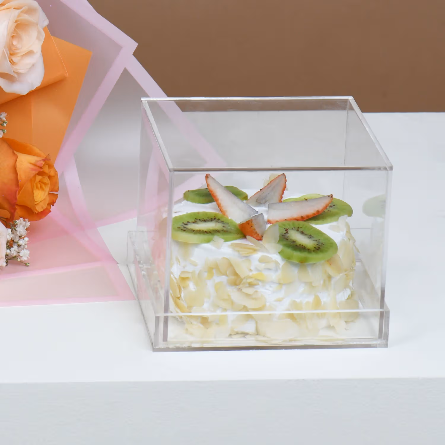 Elegant Bouquet of Orange and Peach Roses with Delightful Fruit Cake