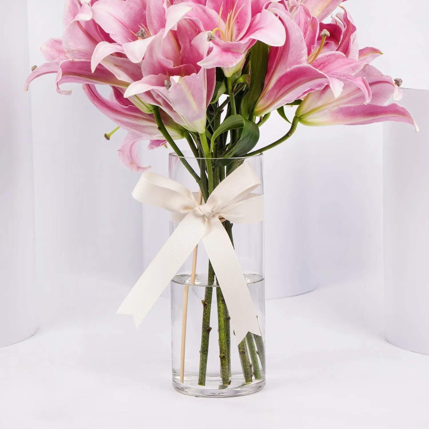 Elegant Blushing Pink Lilies Arrangement with Decorative Topper