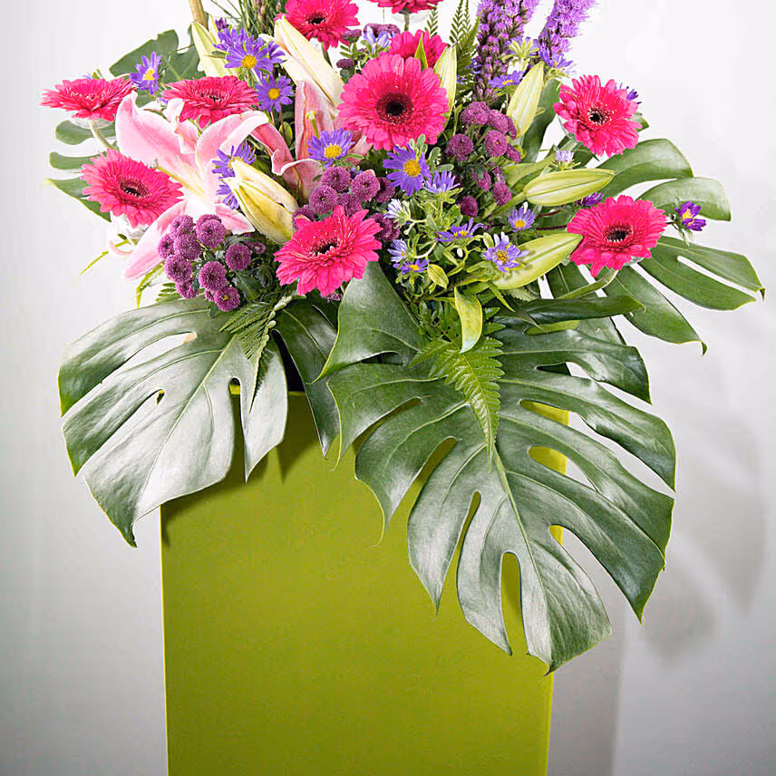 Alluring Mixed Flowers Green Cardboard Stand