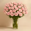 Elegant Bouquet of 50 Stunning Pink Roses with Gypsophila in a Glass Vase