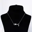 Radiance of Romance: Exquisite Rose Bouquet with Elegant Silver Love Necklace