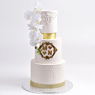 Choco Elegance Engagement Cake with Floral & Gold Accents
