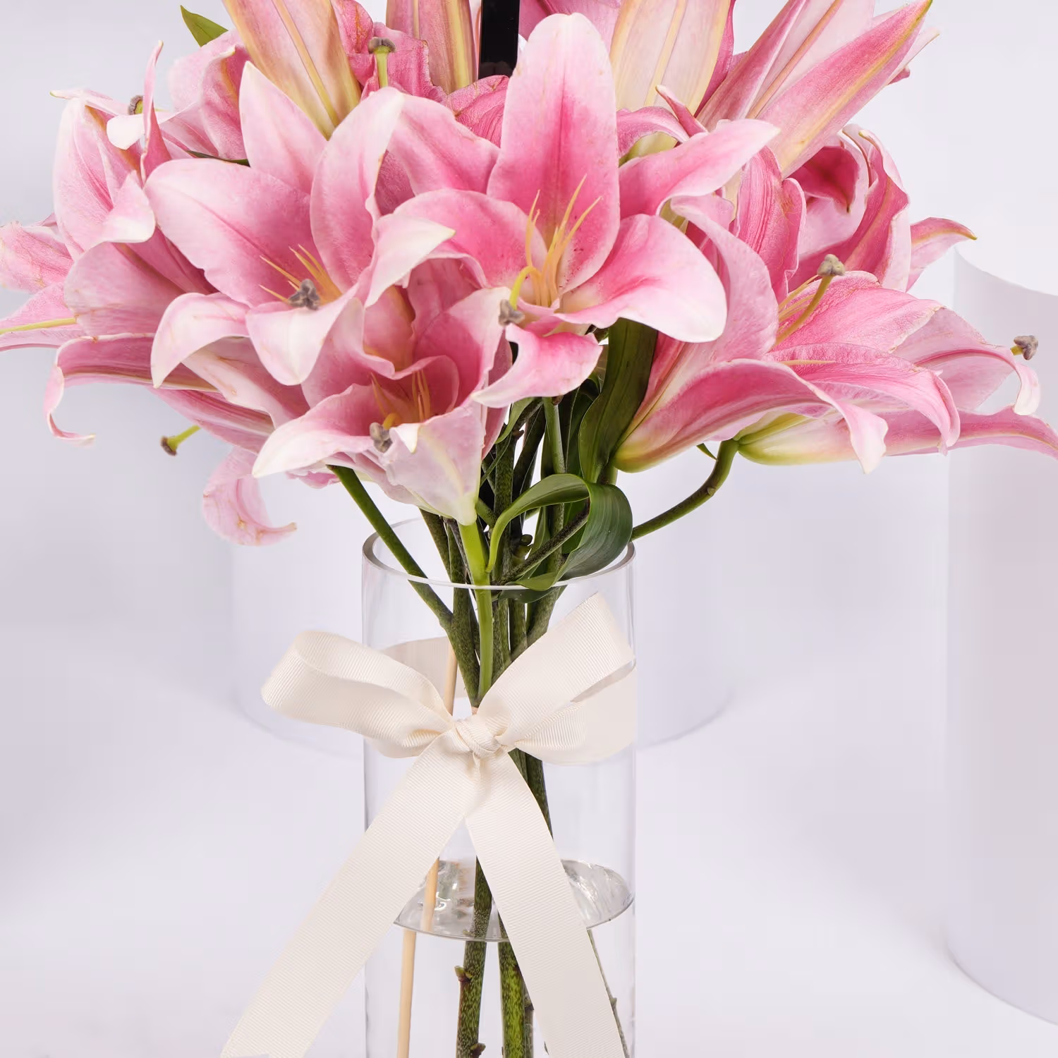 Elegant Blushing Pink Lilies in Glass Vase with Ribbon