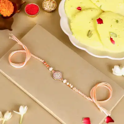 Elegant Rosy American Diamond Rakhi with 1 Kg Ras Malai Delight and Complimentary Roli Chawal