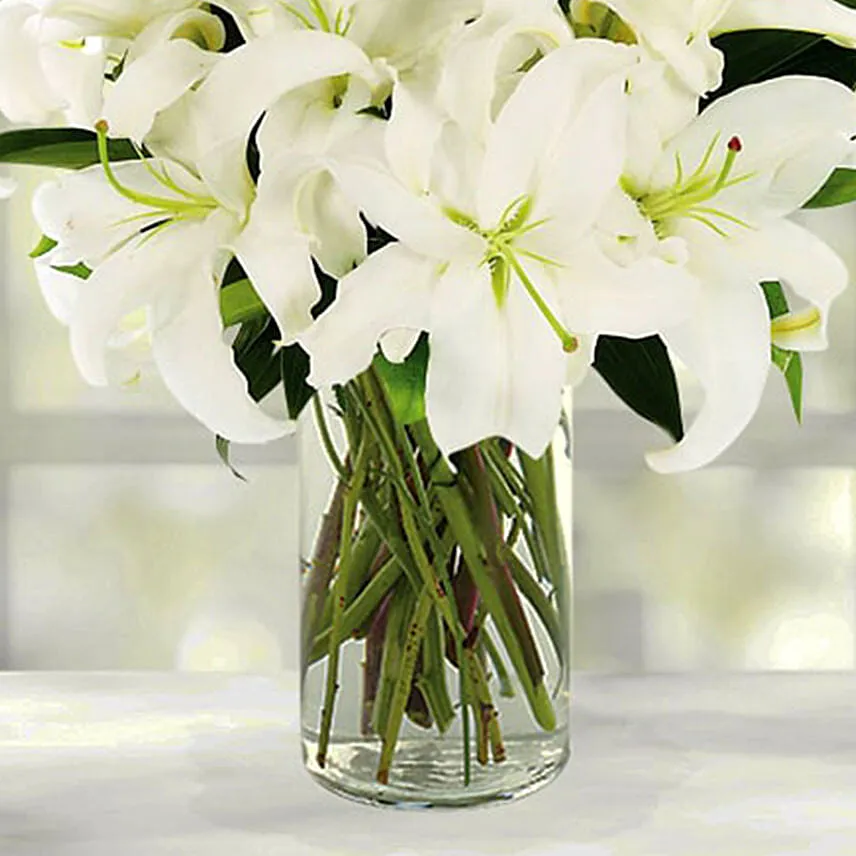 Serene Arranagement Of White Lilies With Ferrero Rocher