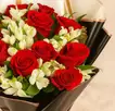 Red Roses And Alstroemeria In Black Wrapping