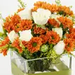 Fiery Strength: Vibrant Orange Chrysanthemum and White Rose Arrangement