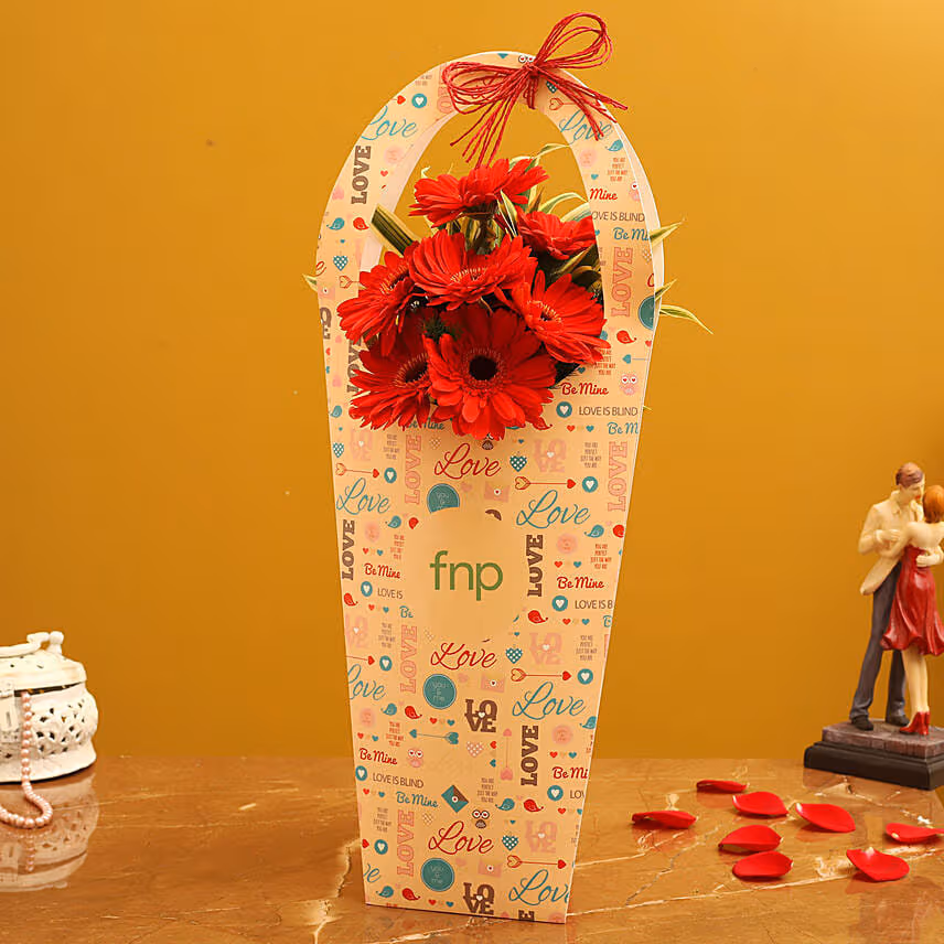 Red Gerberas In FNP Love Sleeve