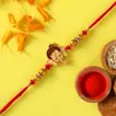 Delightful Bal Ganesha Kids Rakhi with Lindt Extra Creamy Chocolate Bar