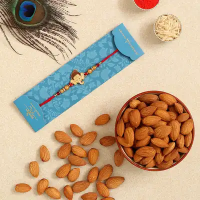 Charming Bal Ganesha Pearl Rakhi for Kids with 100 gms of Premium Almonds