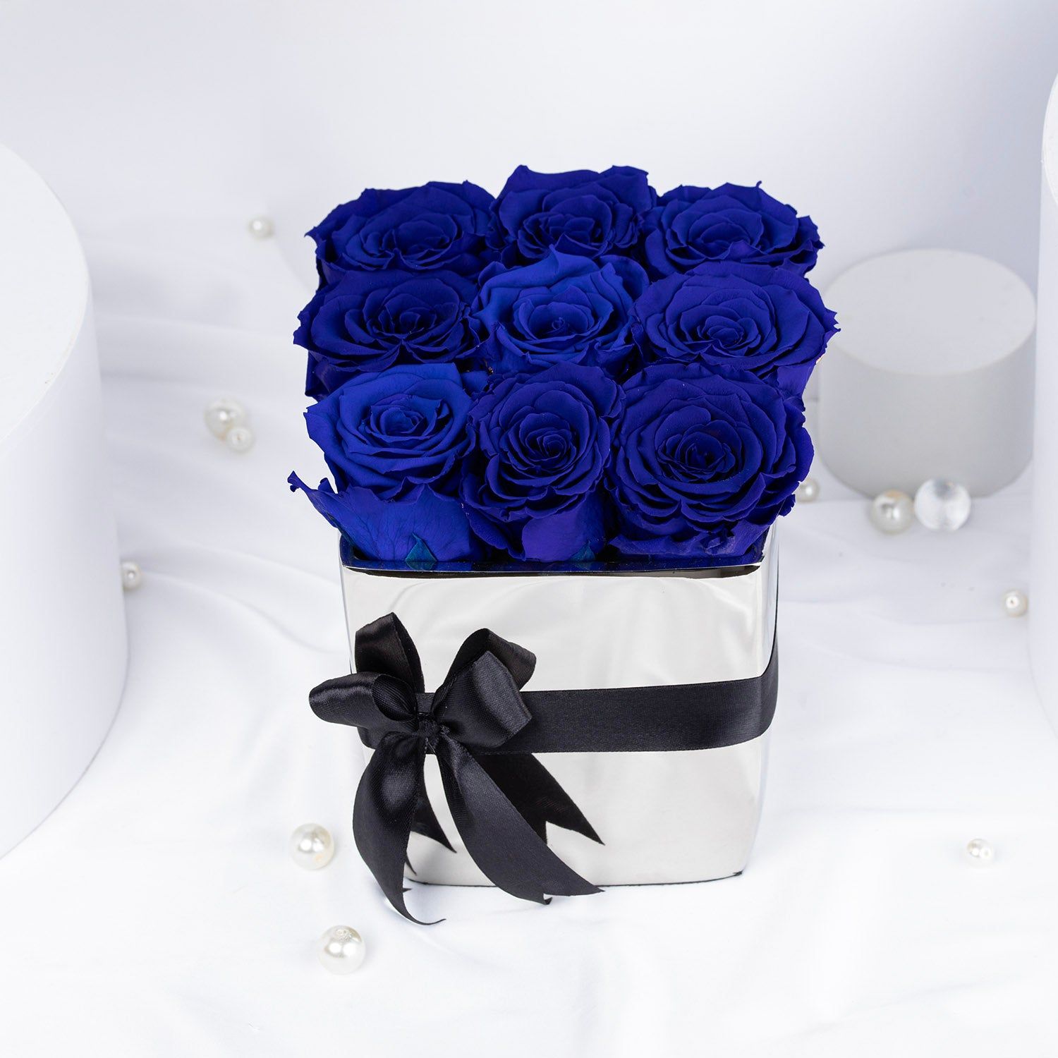 Elegant Blue Forever Roses in Luxurious Silver Vase