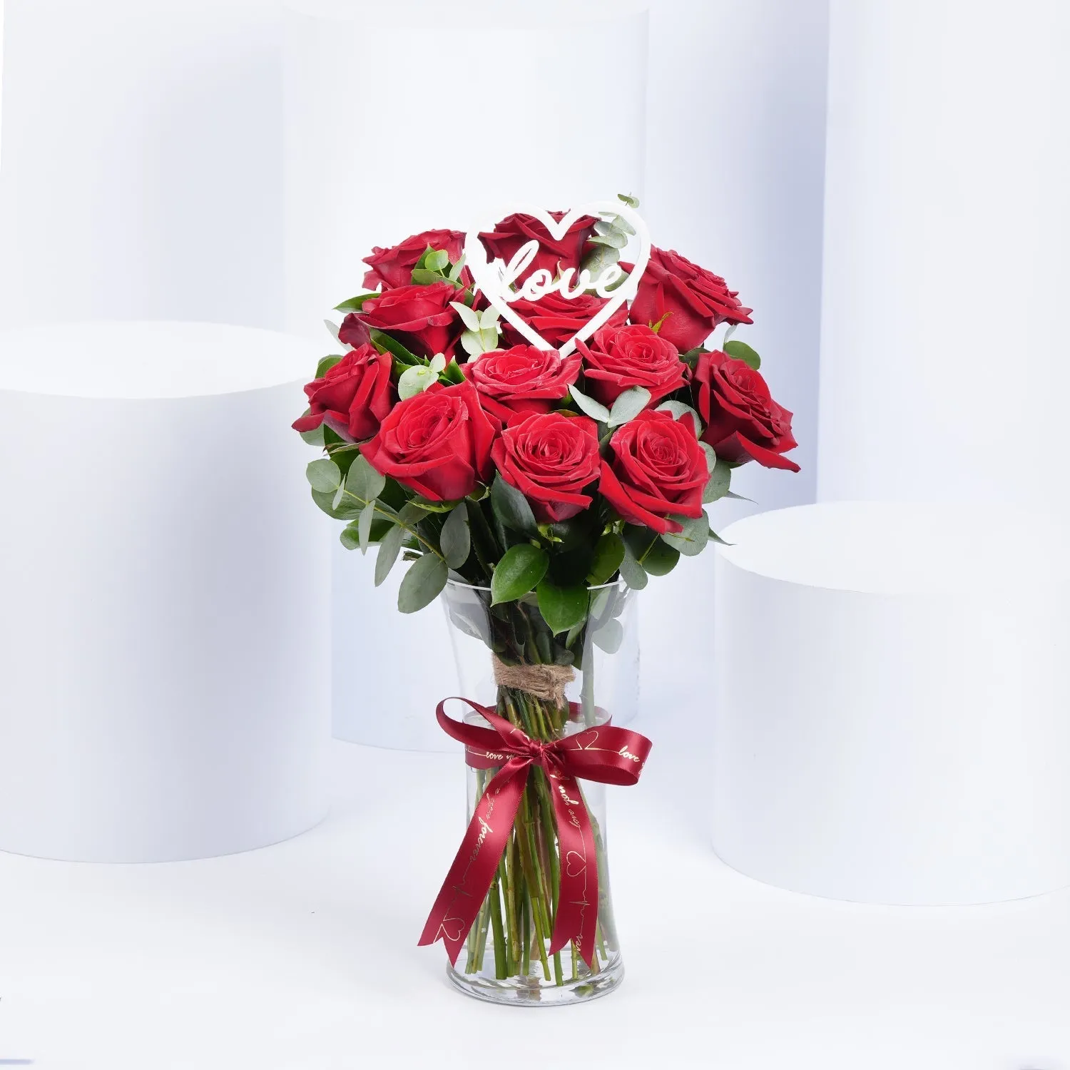 Elegant Red Roses with Eucalyptus in a Romantic Vase