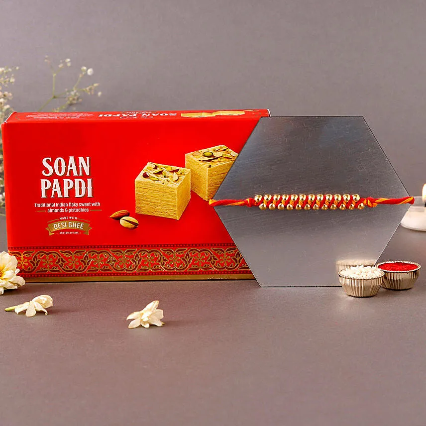 Sneh Elegant Gold Rakhi & Soan Papdi