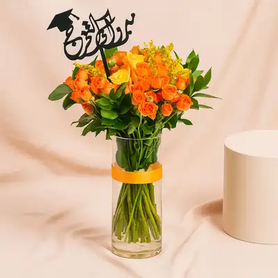 Orange And Yellow Rose Arrangement In A Vase For Graduation