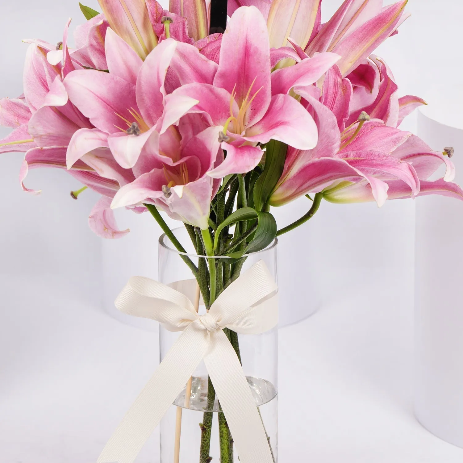 Elegant Blushing Pink Lilies Arrangement with Decorative Topper