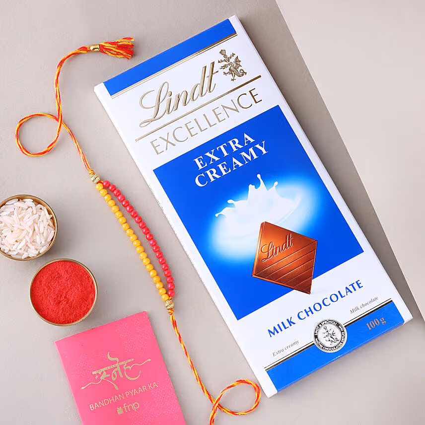 Sneh Red and Yellow Bead Rakhi with Lindt Extra Creamy Milk Chocolate