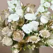 Harmonious Flowers: Elegant White Floral Arrangement in a Gold Round Box